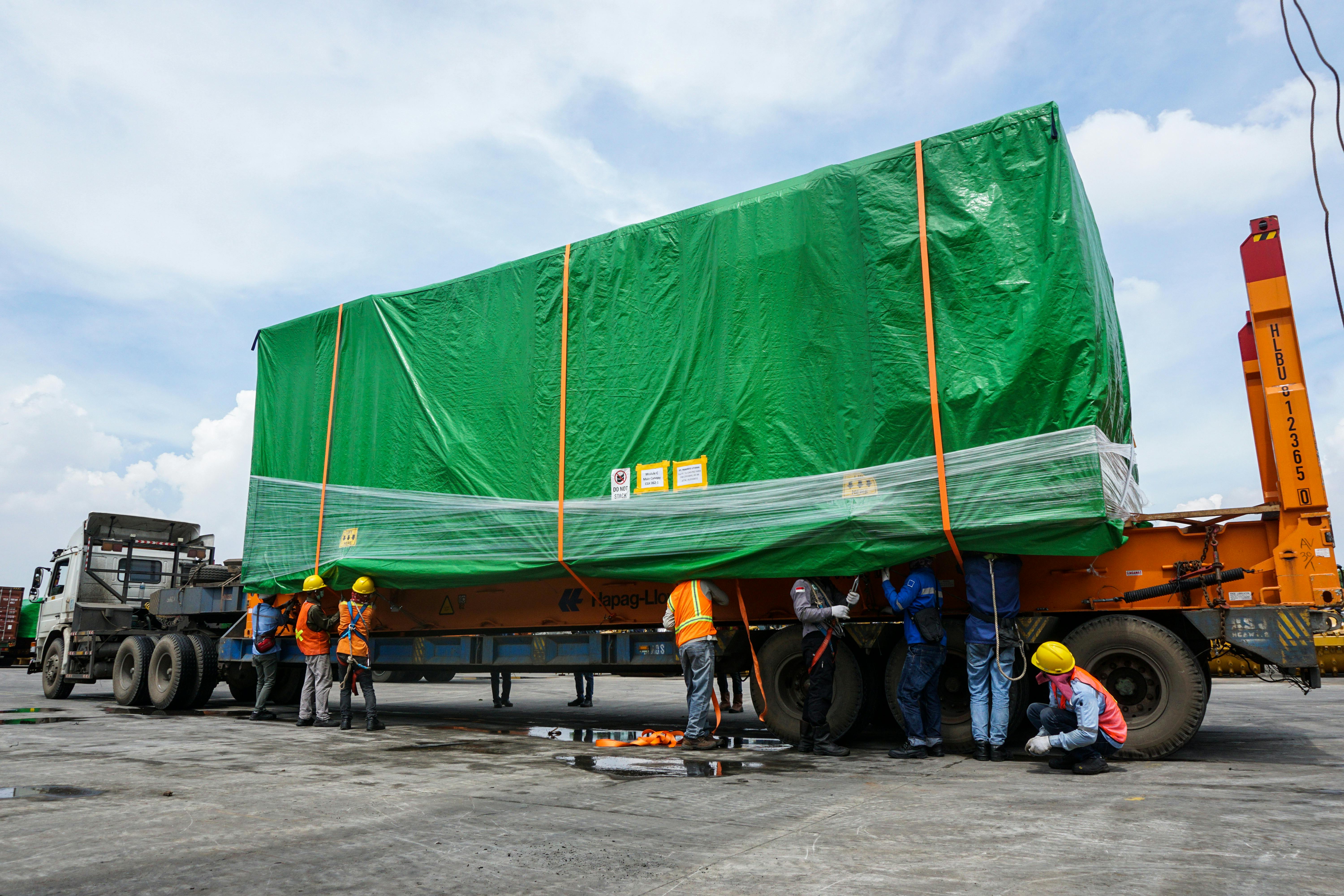 Specialized equipment handling oversized cargo for infrastructure projects